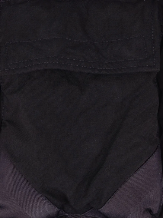 Close up of the black jacket, showing texture of the polyamide fabric