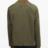 Green jacket worn by a person, showing the jacket's fit