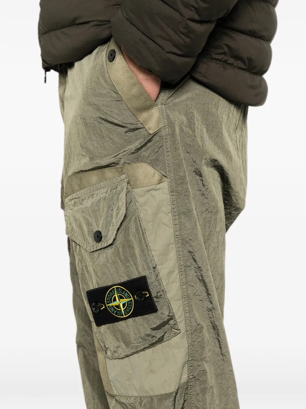 Green pants worn by a person, showing the pants fit