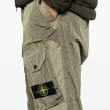 Green pants worn by a person, showing the pants fit