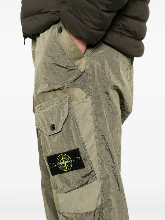 Green pants worn by a person, showing the pants fit