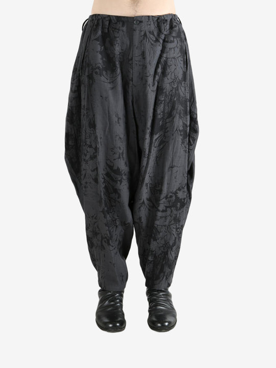 Black pant worn by a person, showing the pant's fit