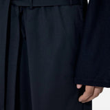 Black pants worn by a person, showing the pants fit
