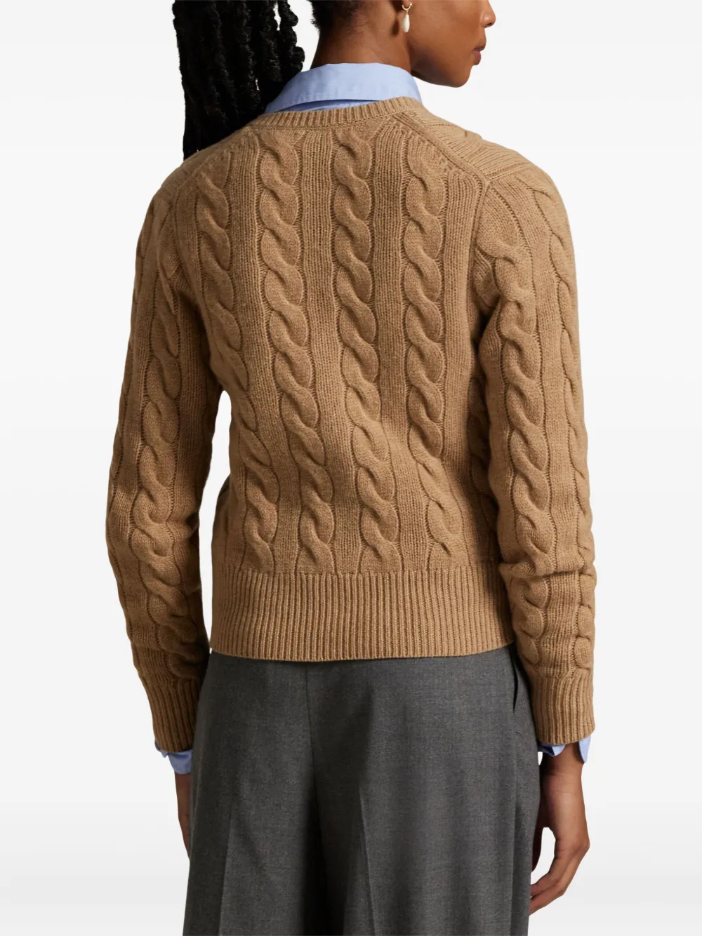 Brown cardigan worn by a person, showing the cardigan's fit