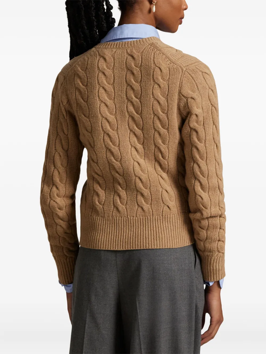Brown cardigan worn by a person, showing the cardigan's fit