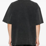 black t-shirt worn by a person, showing the t-shirt fit