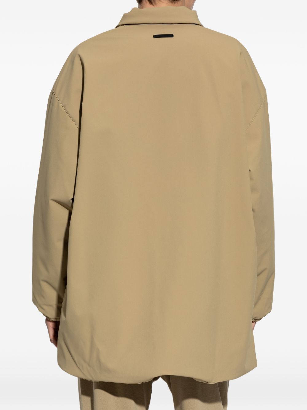 Tan jacket worn by a person, showing the jacket's fit