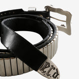 Close up of the black belt, showing texture of the leather fabric