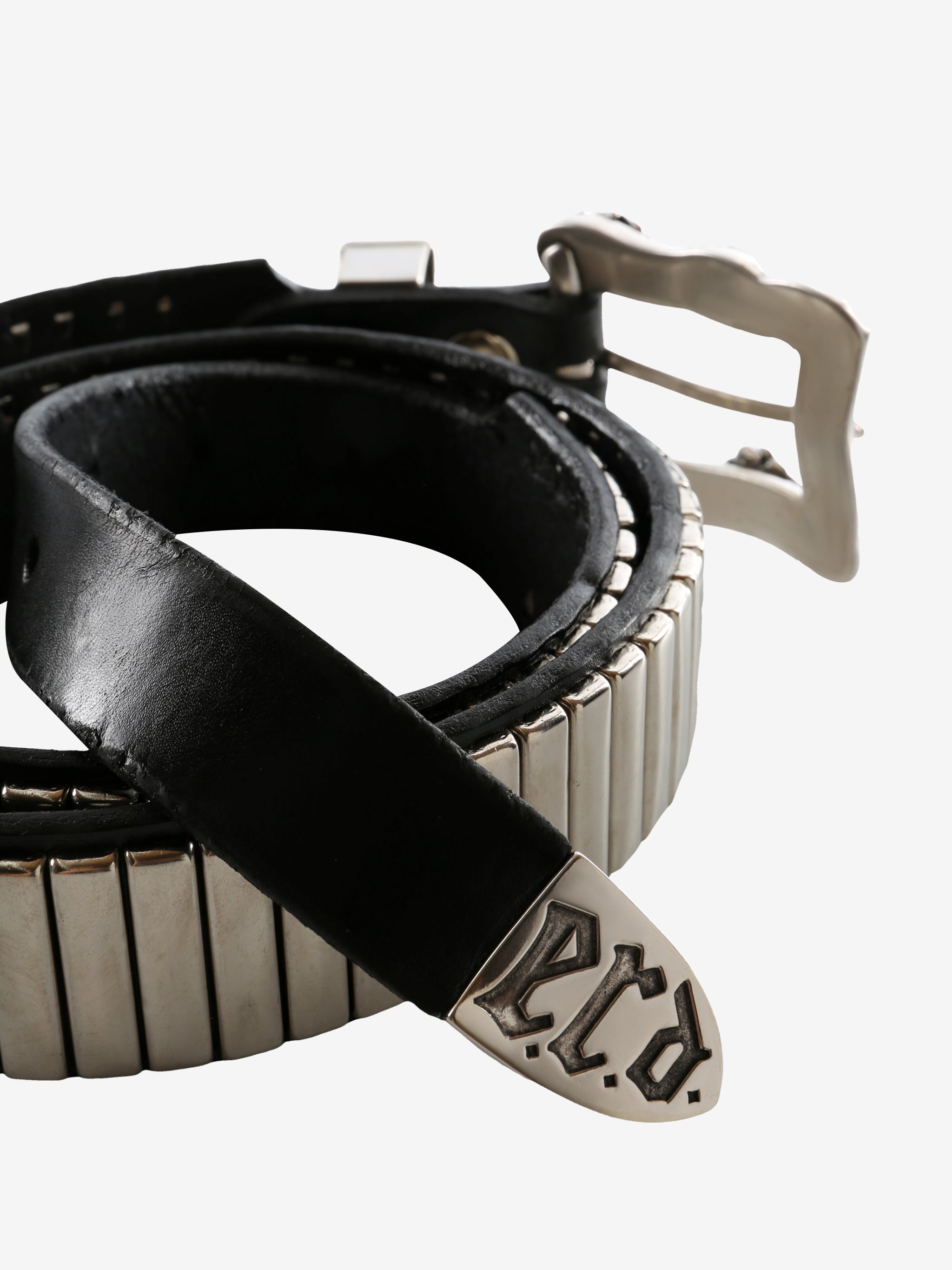 Close up of the black belt, showing texture of the leather fabric