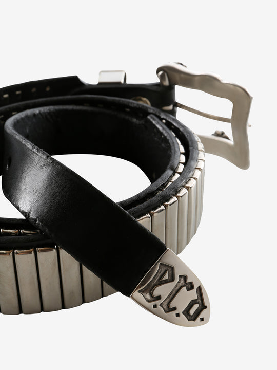 Close up of the black belt, showing texture of the leather fabric