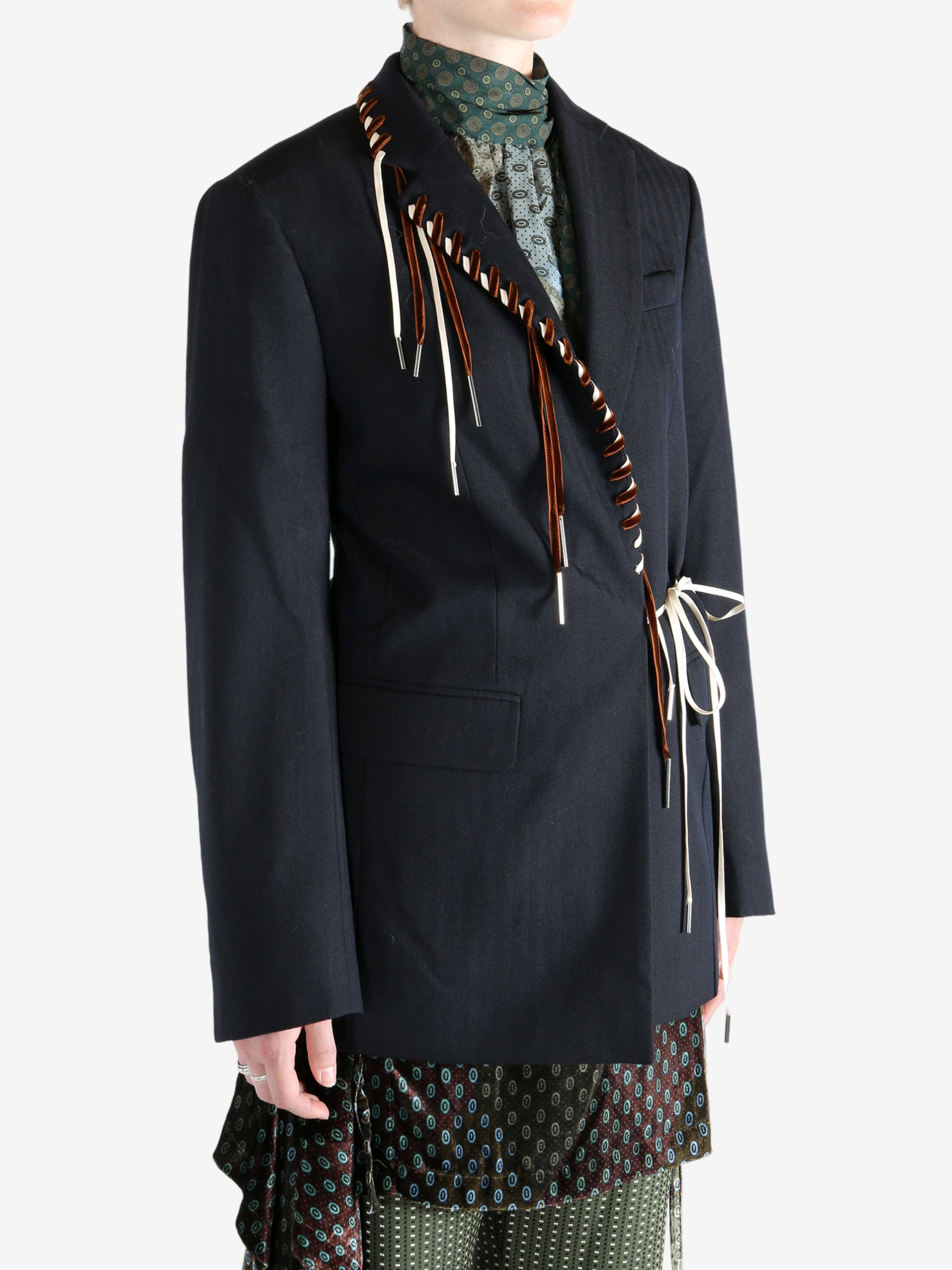 Navy coat worn by a person, showing the coat's fit