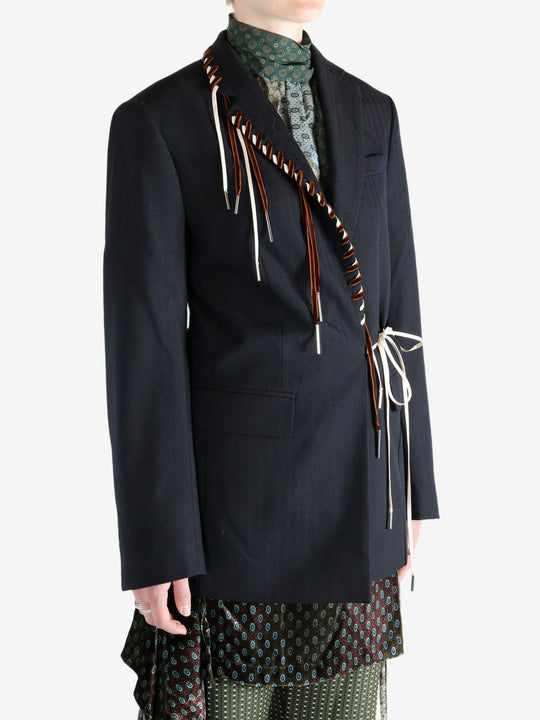 Navy coat worn by a person, showing the coat's fit