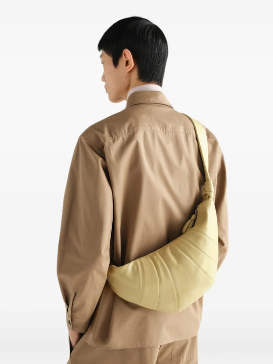 Tan bag worn by a person, showing the bag fit