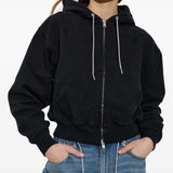 Black hoodie worn by a person, showing the hoodie's fit