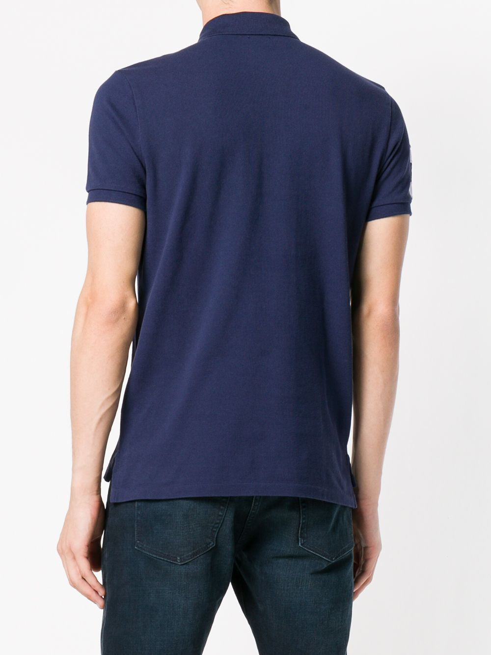 Navy T-shirt worn by a person, showing the shirt's fit