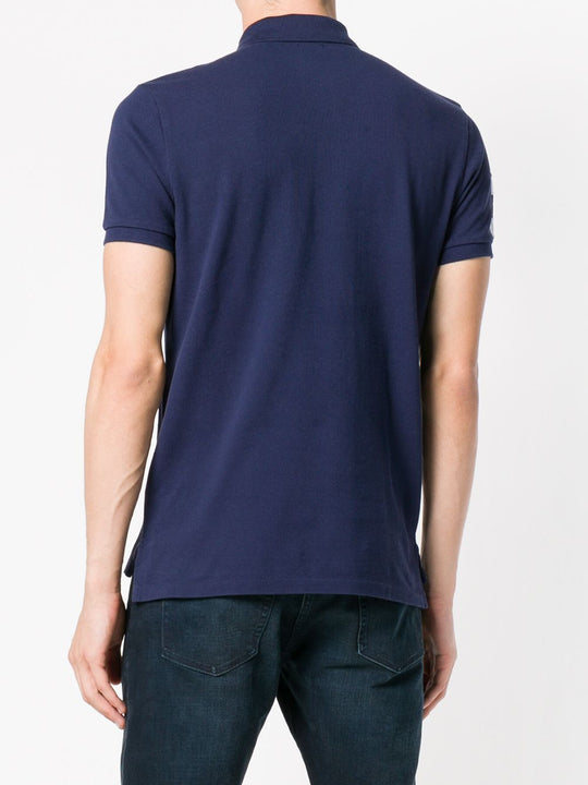 Navy T-shirt worn by a person, showing the shirt's fit