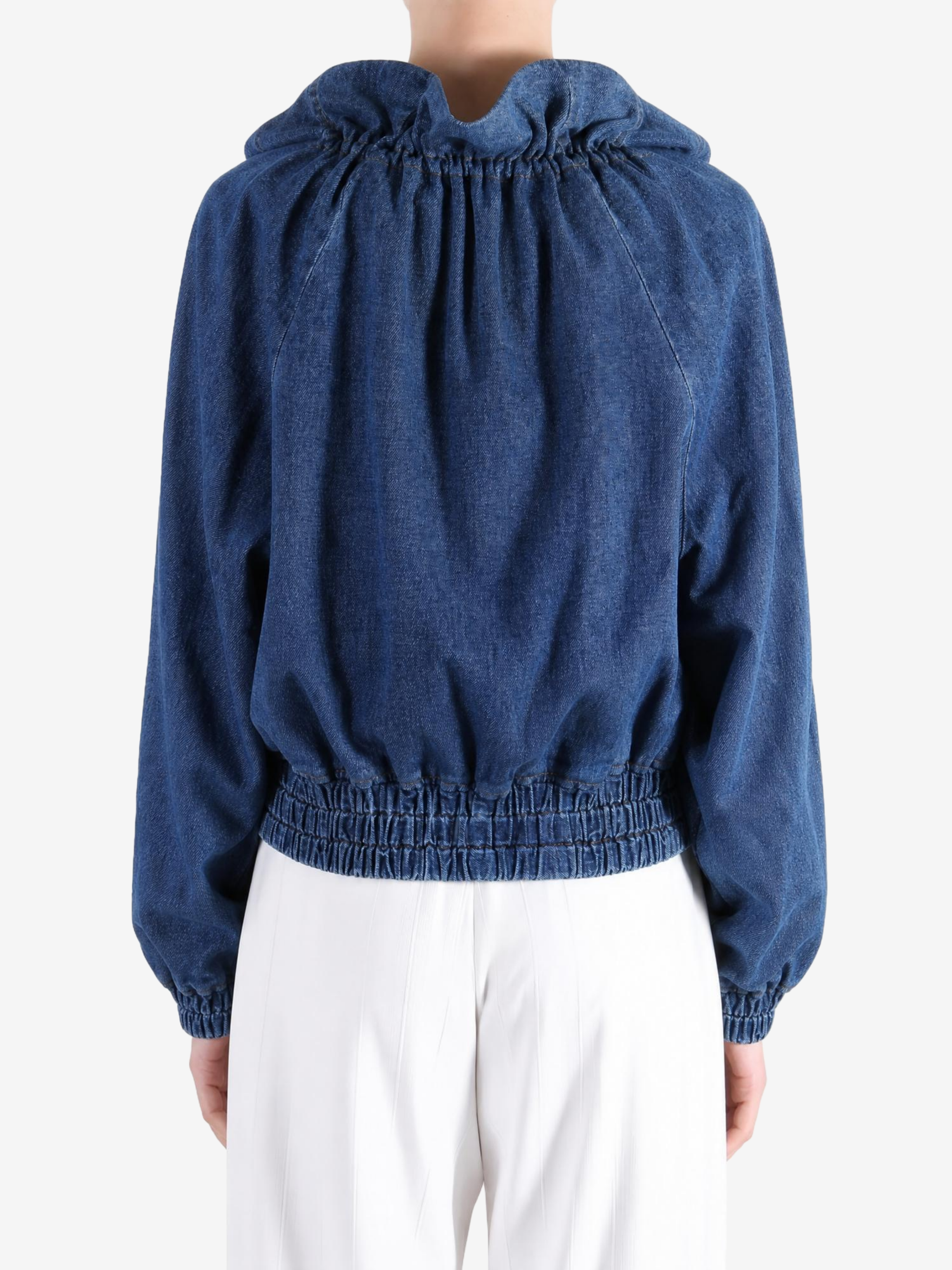 Blue jacket worn by a person, showing the jacket fit