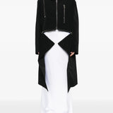 black jacket worn by a person, showing the jacket's fit
