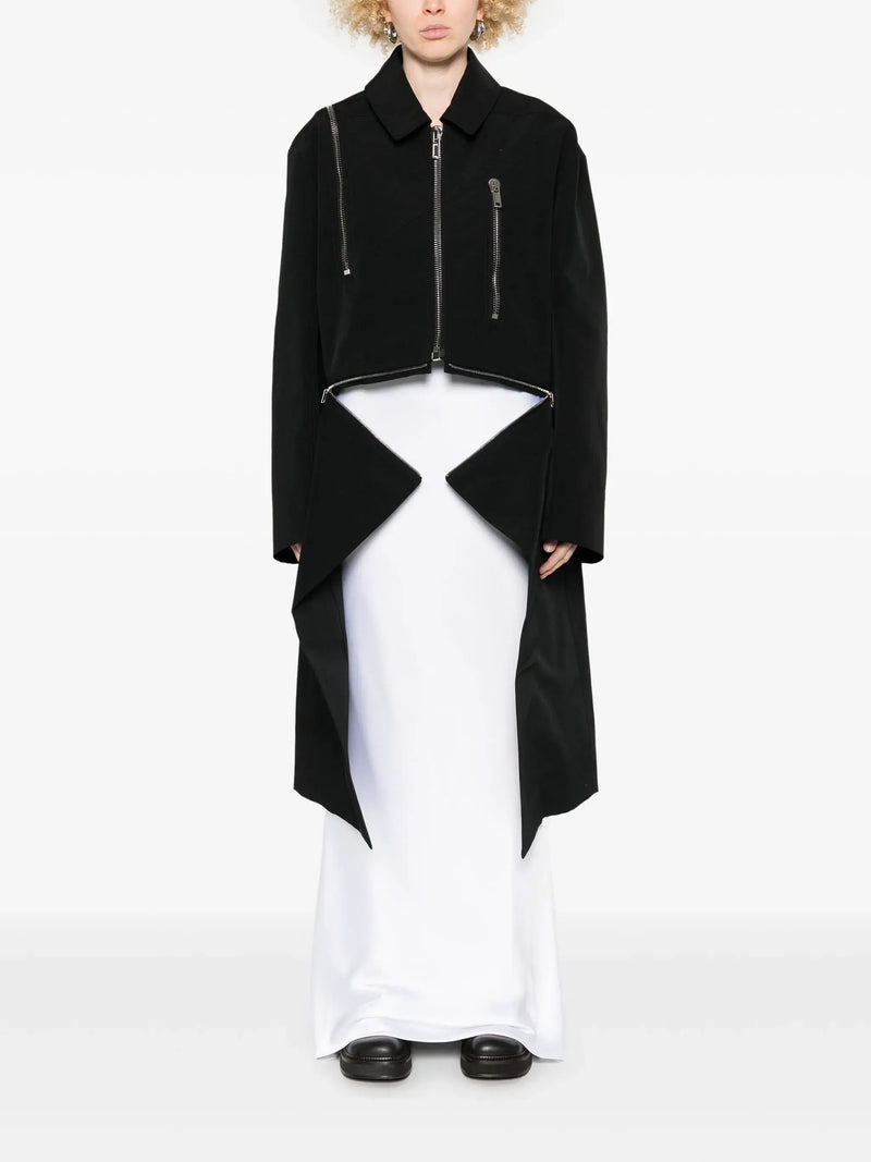 black jacket worn by a person, showing the jacket's fit
