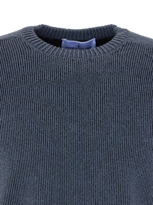 Close up of grey sweashirt, showing texture of the polyamide and cotton and elastane fabric