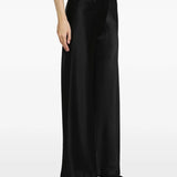 Black pants worn by a person, showing the pants fit