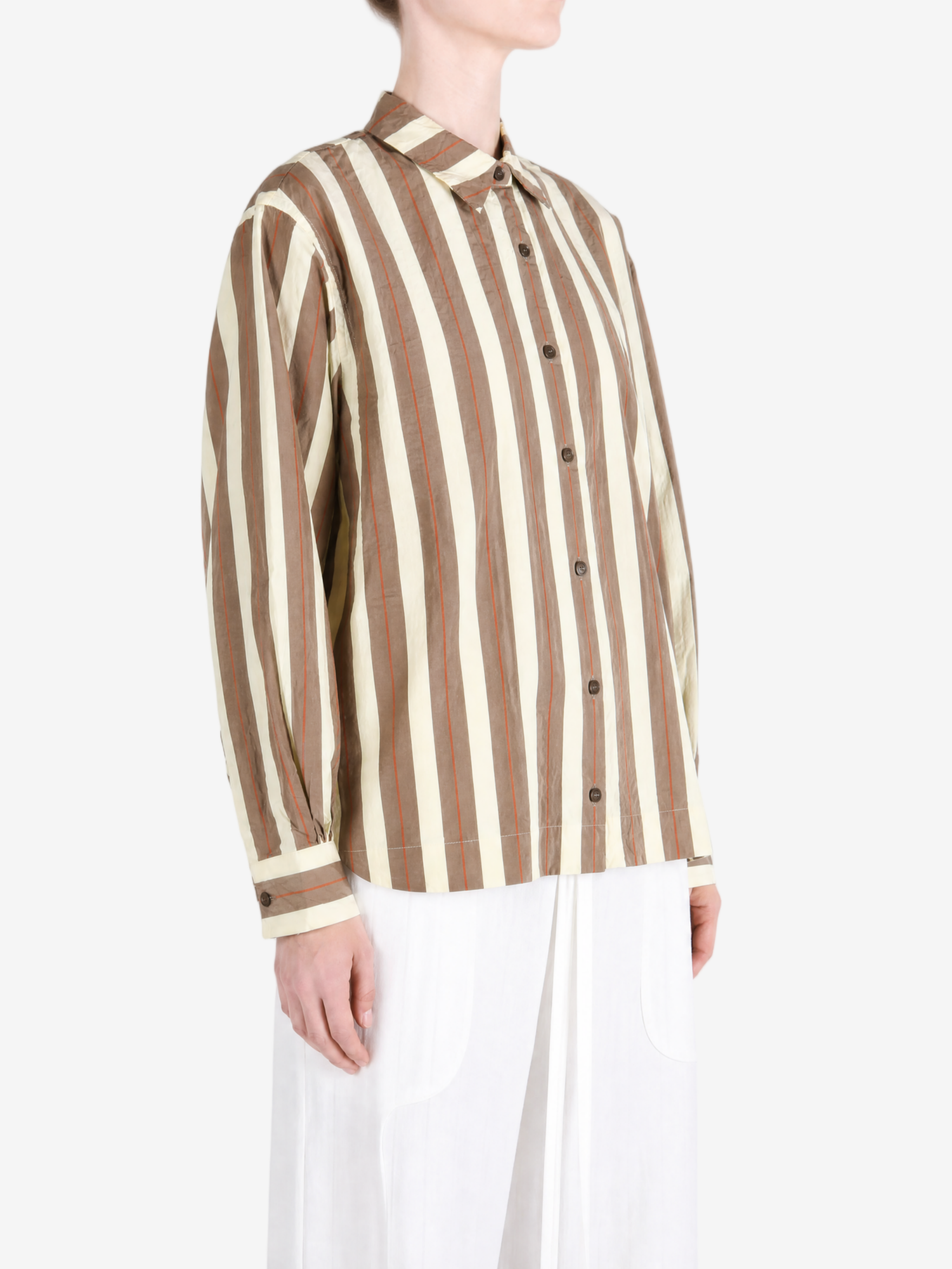 Brown shirt worn by a person, showing the shirt fit
