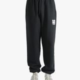 Black sweatpants worn by a person, showing the sweatpants fit