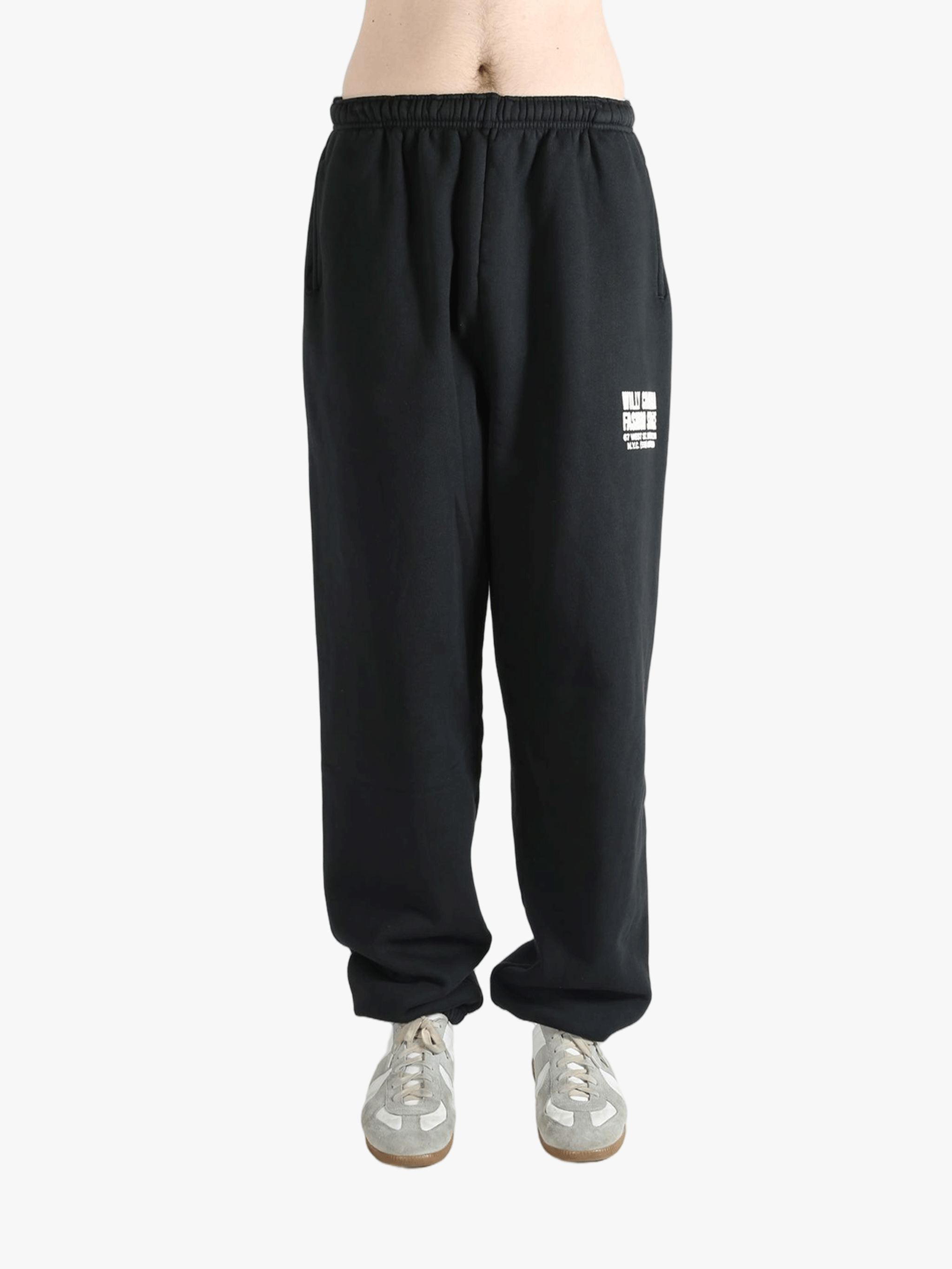 Black sweatpants worn by a person, showing the sweatpants fit