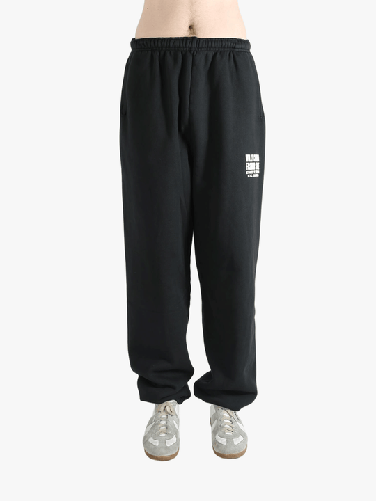 Black sweatpants worn by a person, showing the sweatpants fit