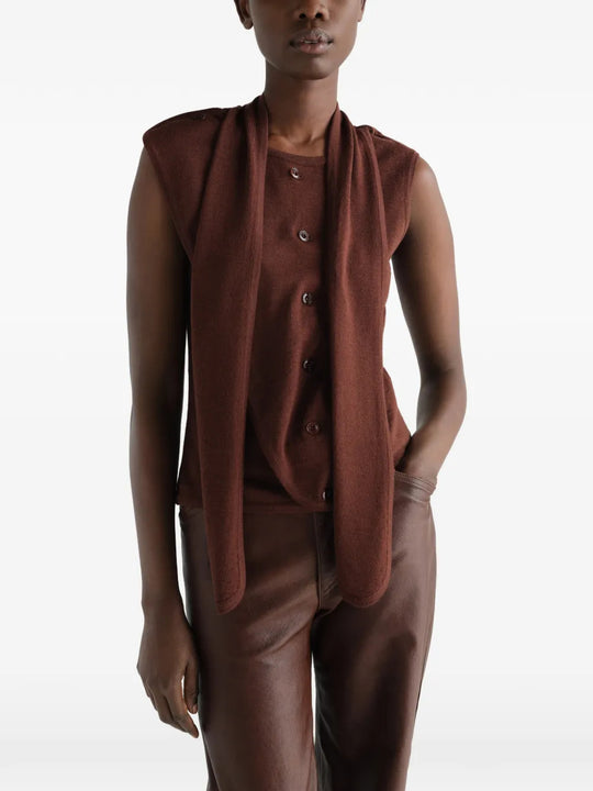Brown top worn by a person, showing the top fit