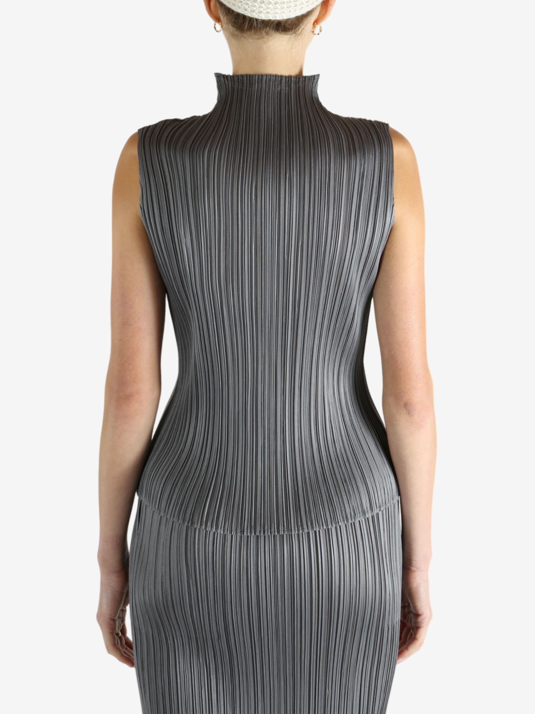 Grey shirts worn by a person, showing the shirts fit