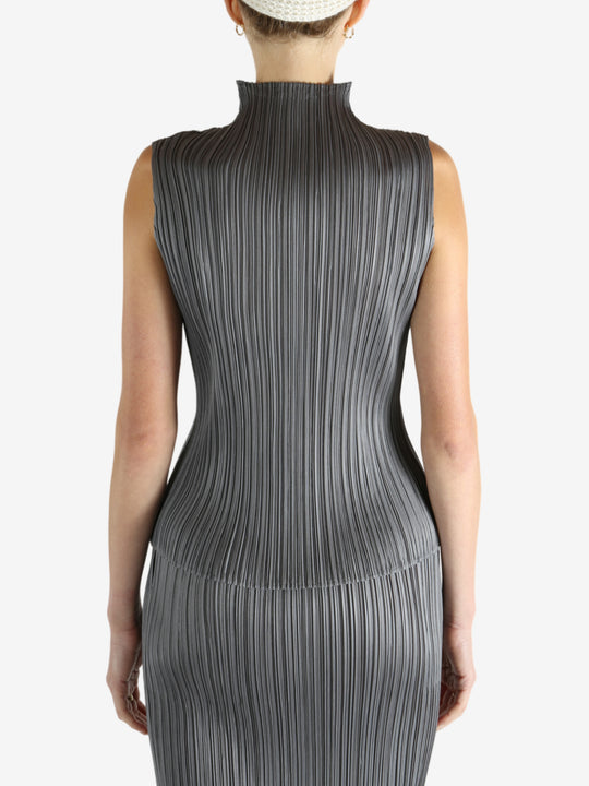 Grey shirts worn by a person, showing the shirts fit