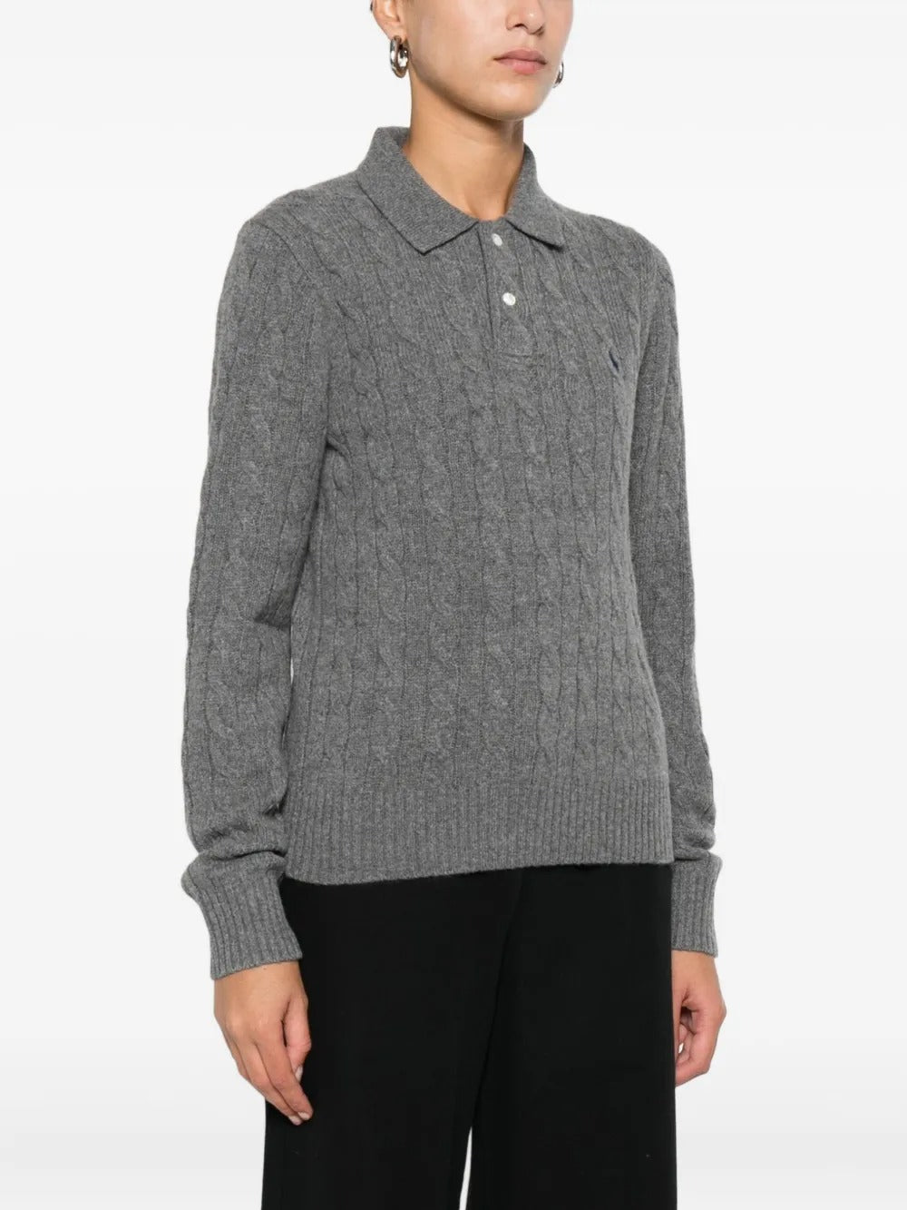 Grey knitwear worn by a person, showing the knitwear's fit