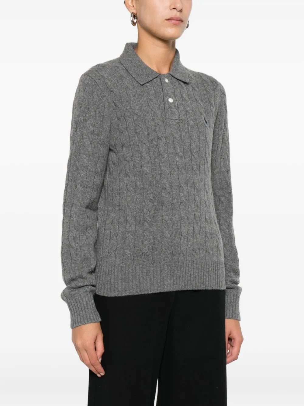 Grey knitwear worn by a person, showing the knitwear's fit
