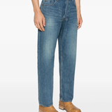 Blue pants worn by a person, showing the pants' fit