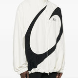 White jacket worn by a person, showing the jacket's fit