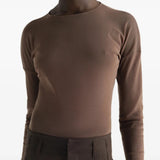 Brown top worn by a person, showing the top fit