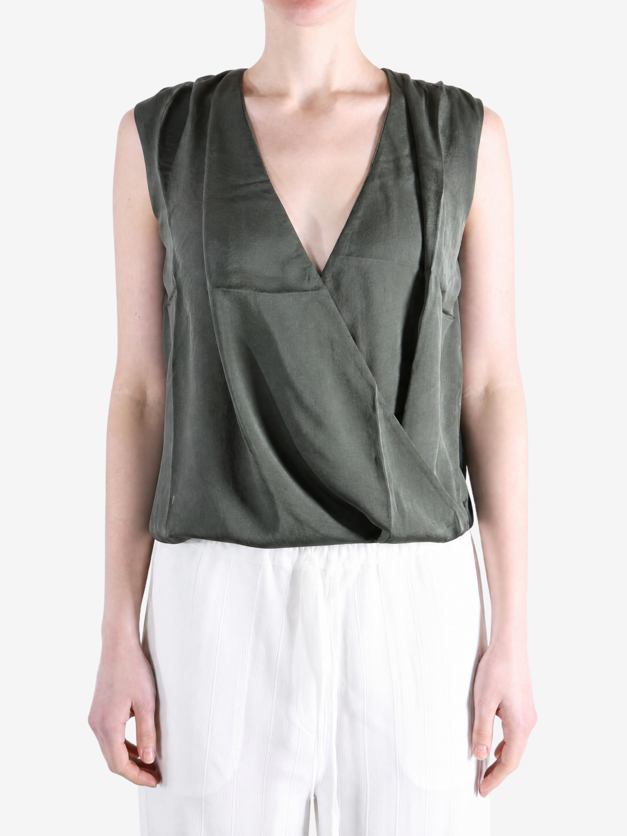 Green top worn by a person, showing the top fit