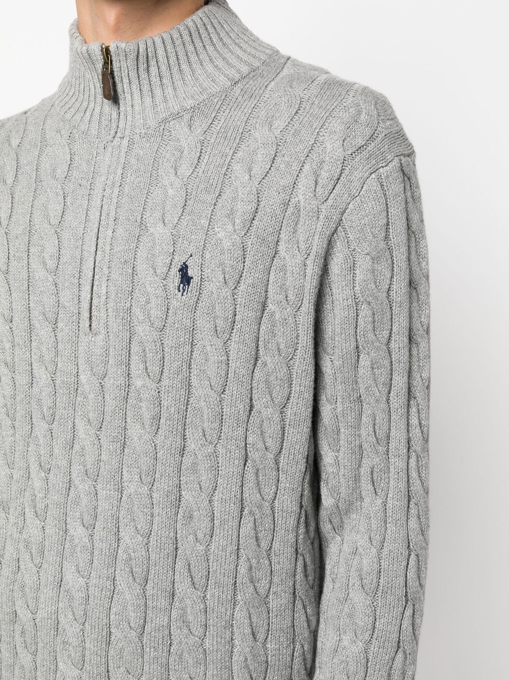 Close up of grey sweater, showing texture of the cotton fabric