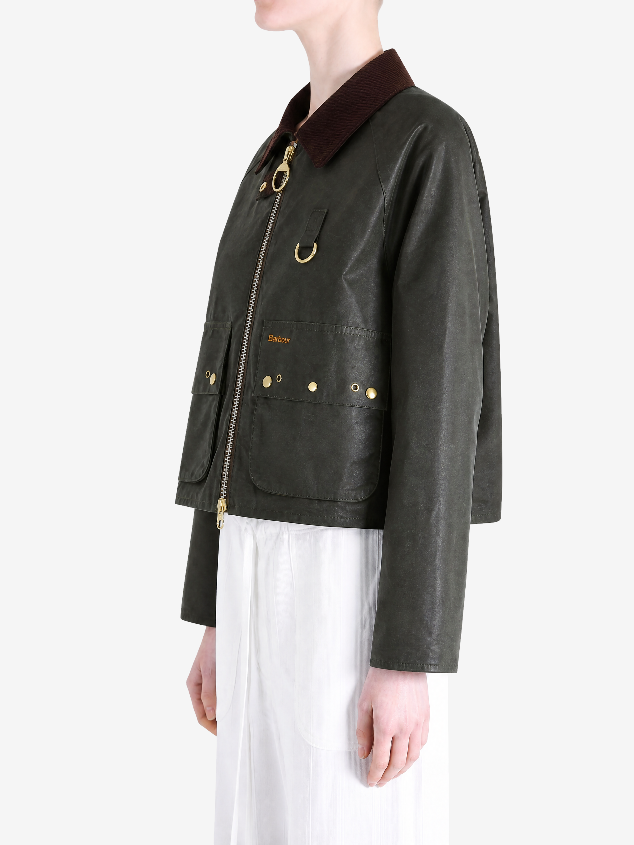 Green jacket worn by a person, showing the jacket fit