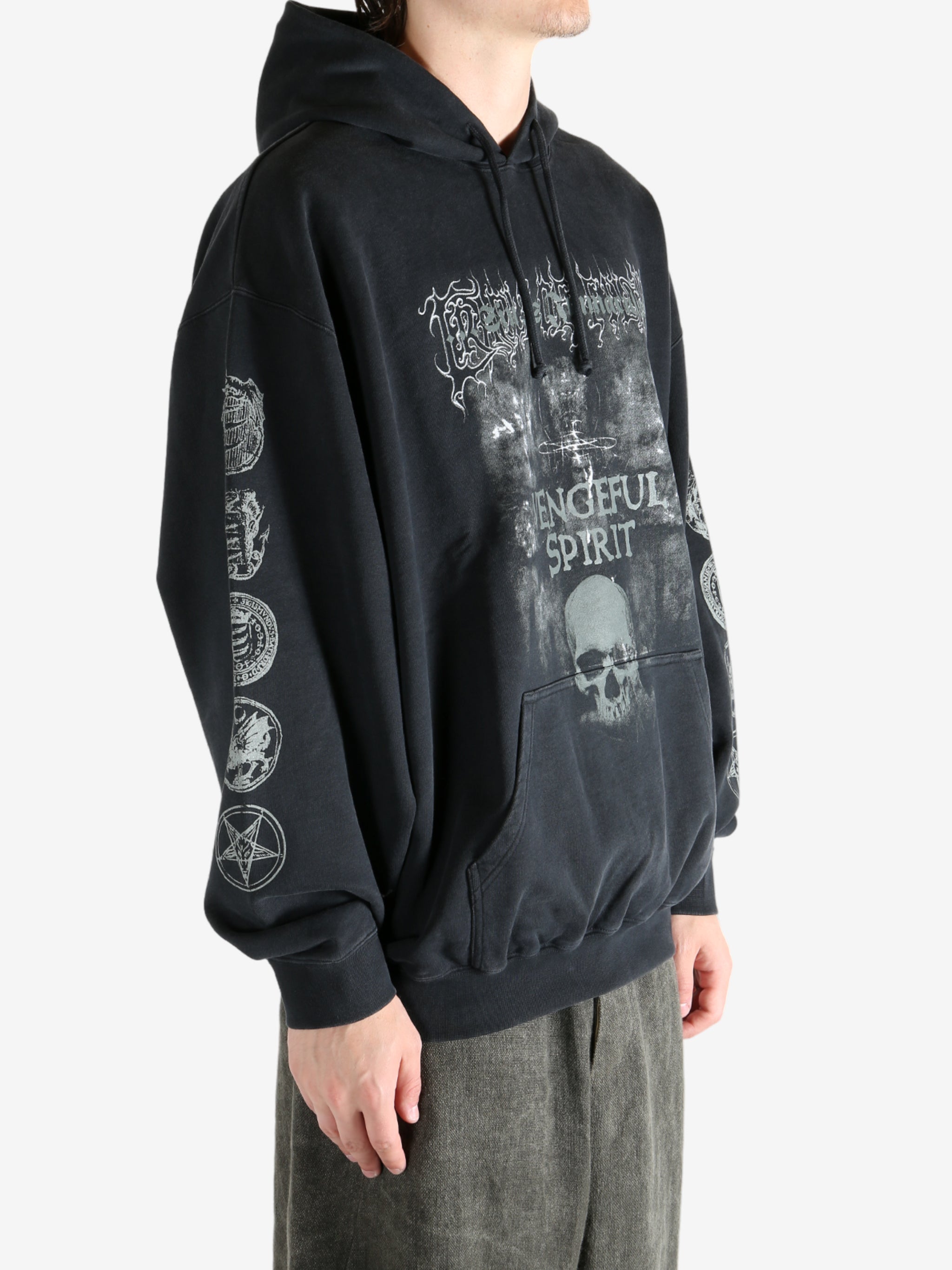 Black hoodie worn by a person, showing the hoodie's fit