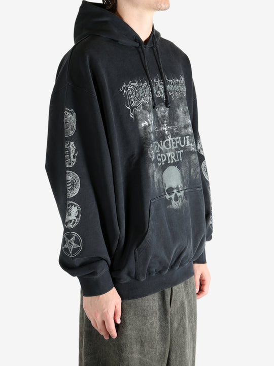 Black hoodie worn by a person, showing the hoodie's fit