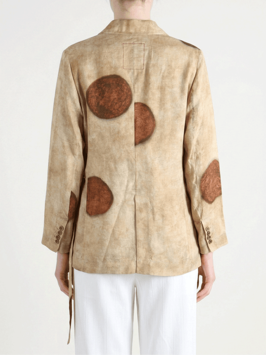 Tan shirt worn by a person, showing the shirt fit