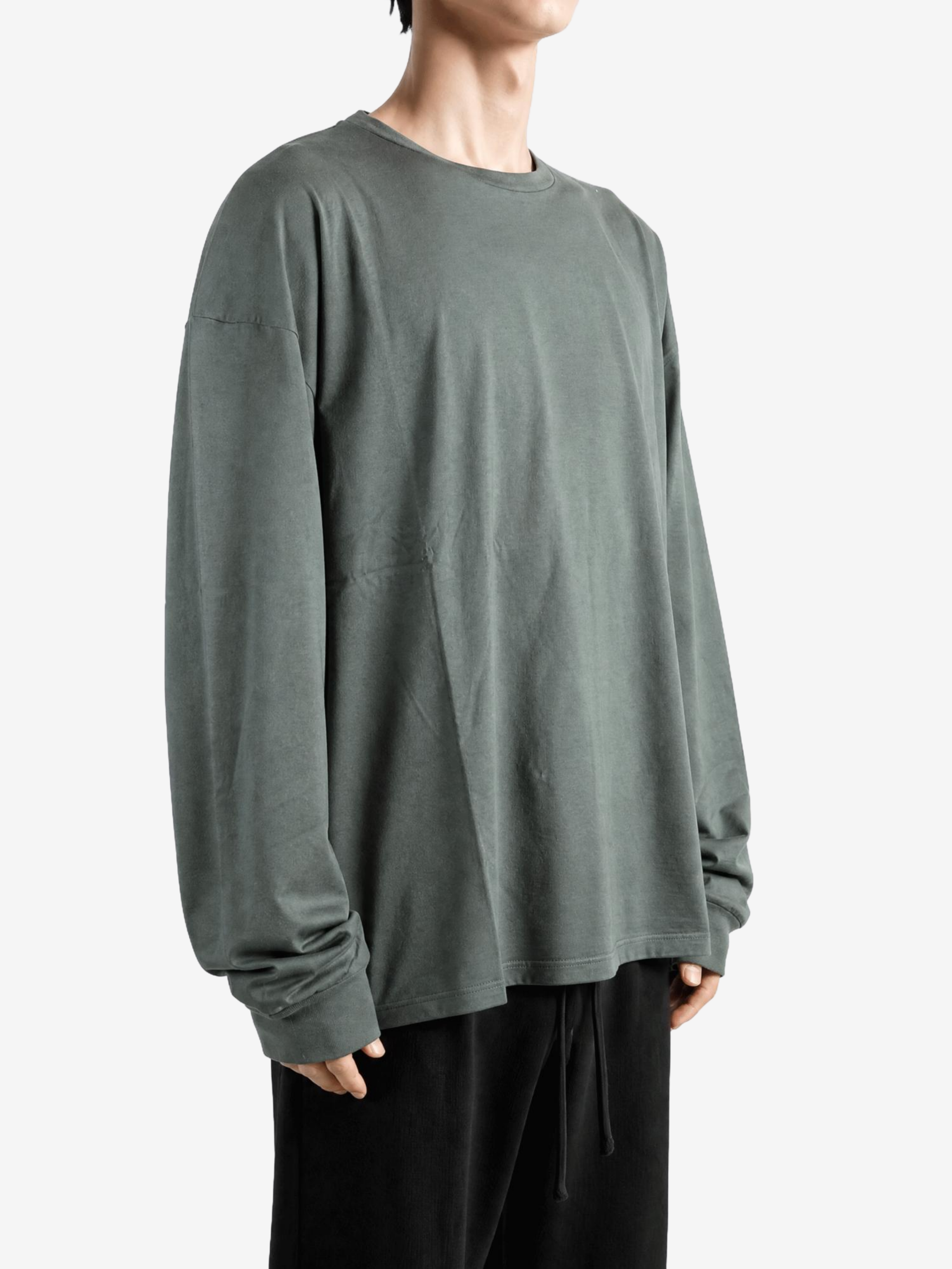 Green t-shirt worn by a person, showing the t-shirt fit