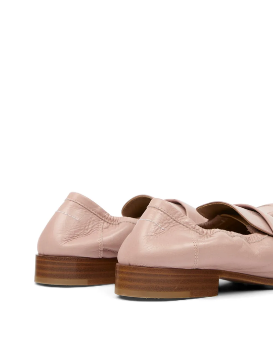 Close up of pink loafers, showing texture of the Calf Leather fabric