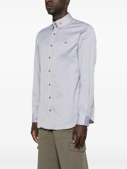 Blue shirt worn by a person, showing the shirt fit