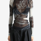 Grey top worn by a person, showing the top's fit