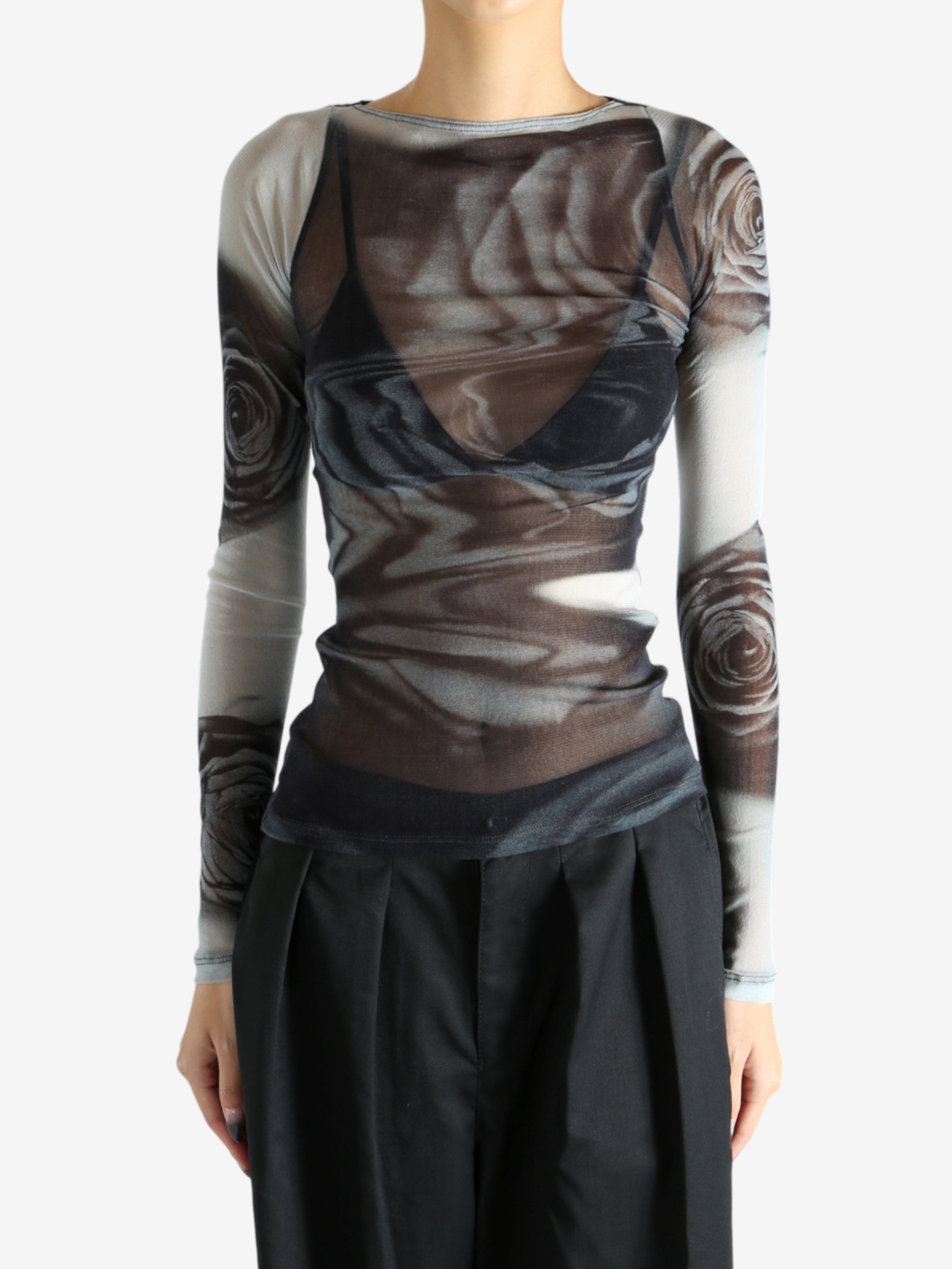 Grey top worn by a person, showing the top's fit