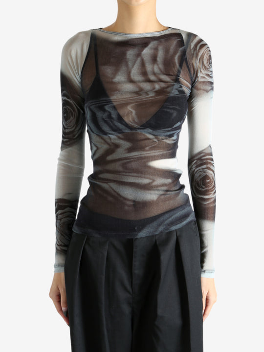 Grey top worn by a person, showing the top's fit