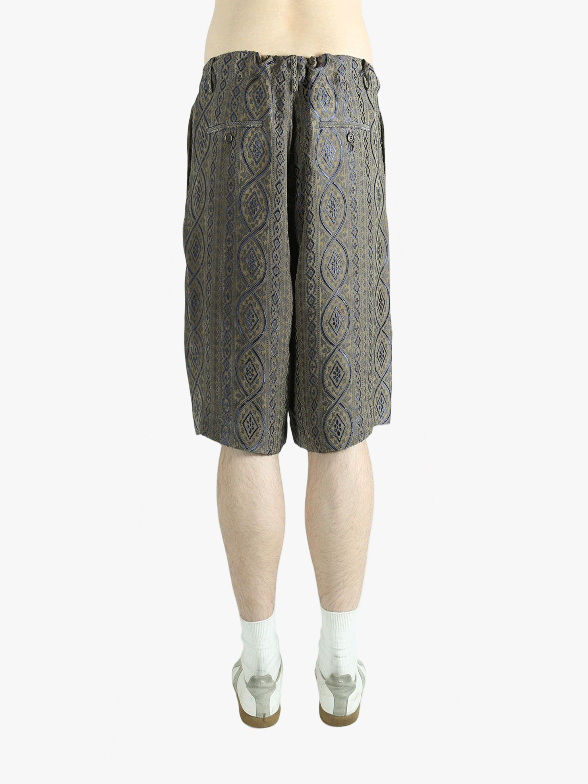 Blue pants worn by a person, showing the pants' fit